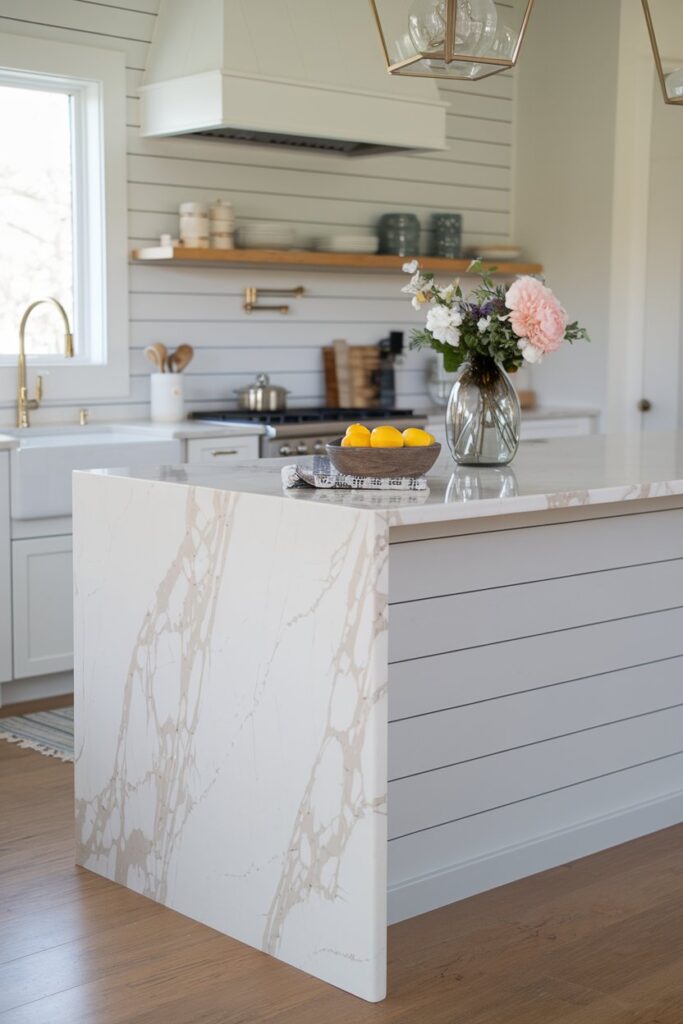A modern kitchen with a shiplap-paneled island painted in soft gray.