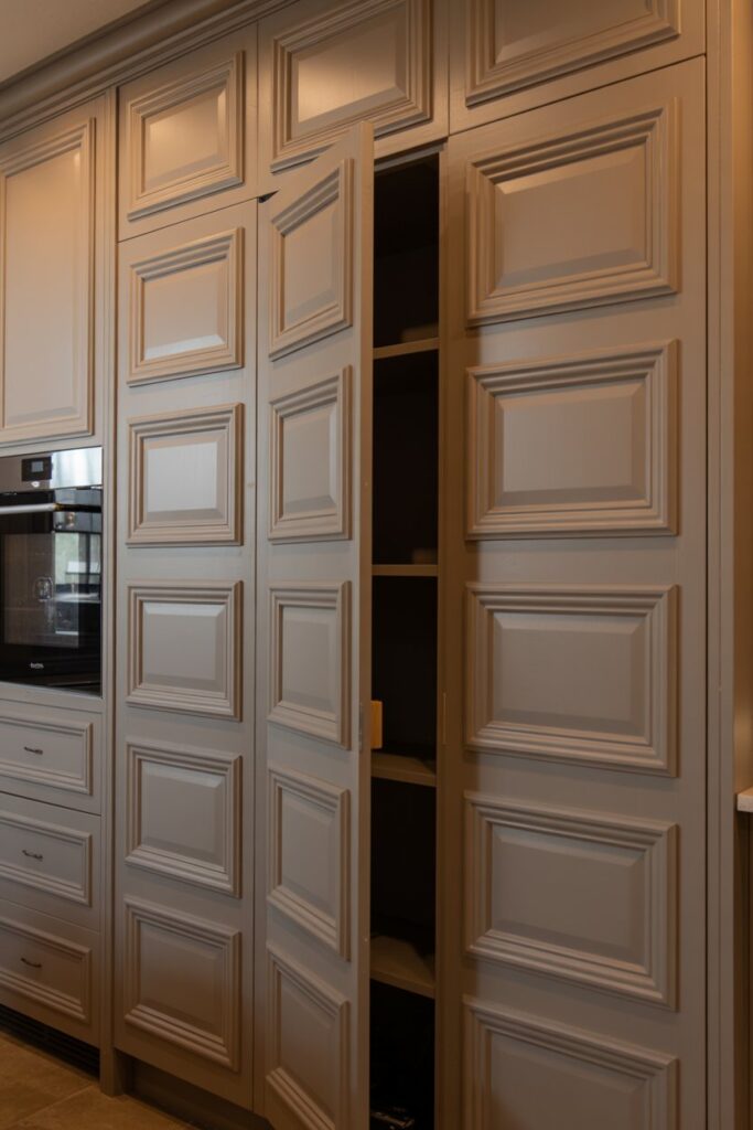 Pantry Concealed by Paneling