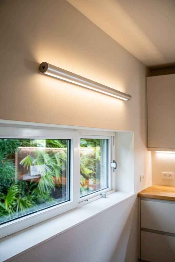 Slim Tube Wall Light Above the Window