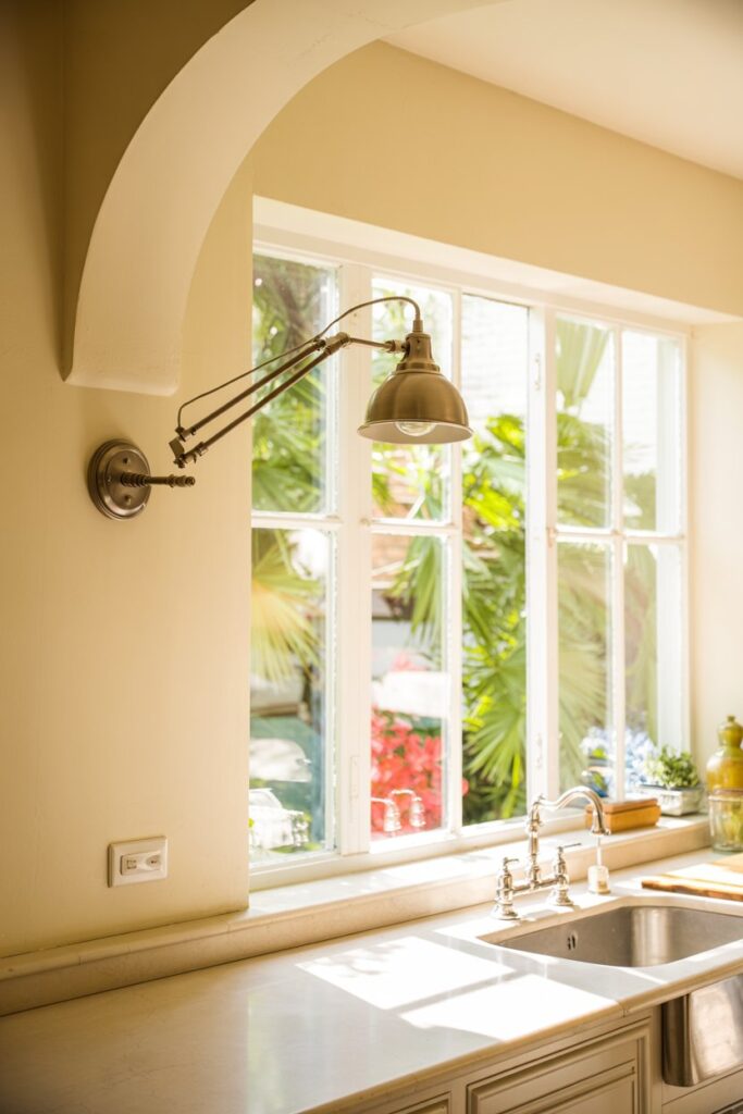 Adjustable Arm Wall Sconce Above the Window