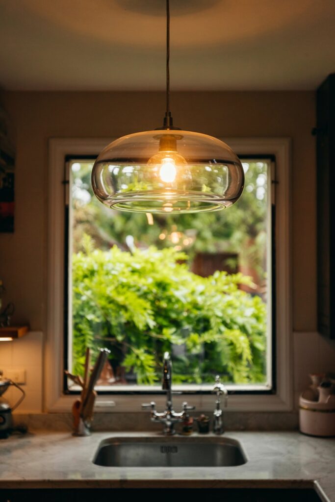 Frosted Glass Pendant Over the Sink Window